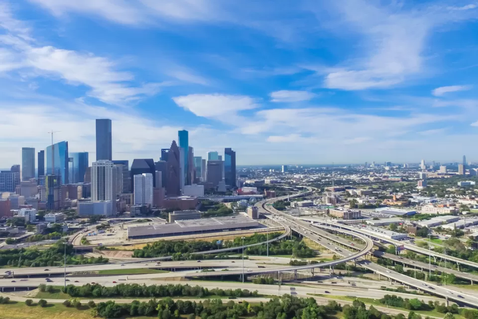 Aerial view of freeways and downtown Houston skyline